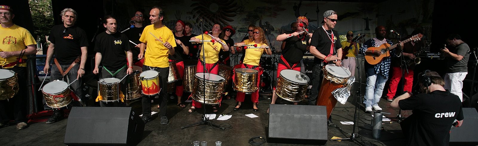 medium size percussion ensemble performing together with a band